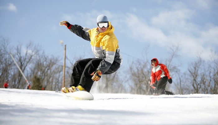 Snowboarding on sunny day